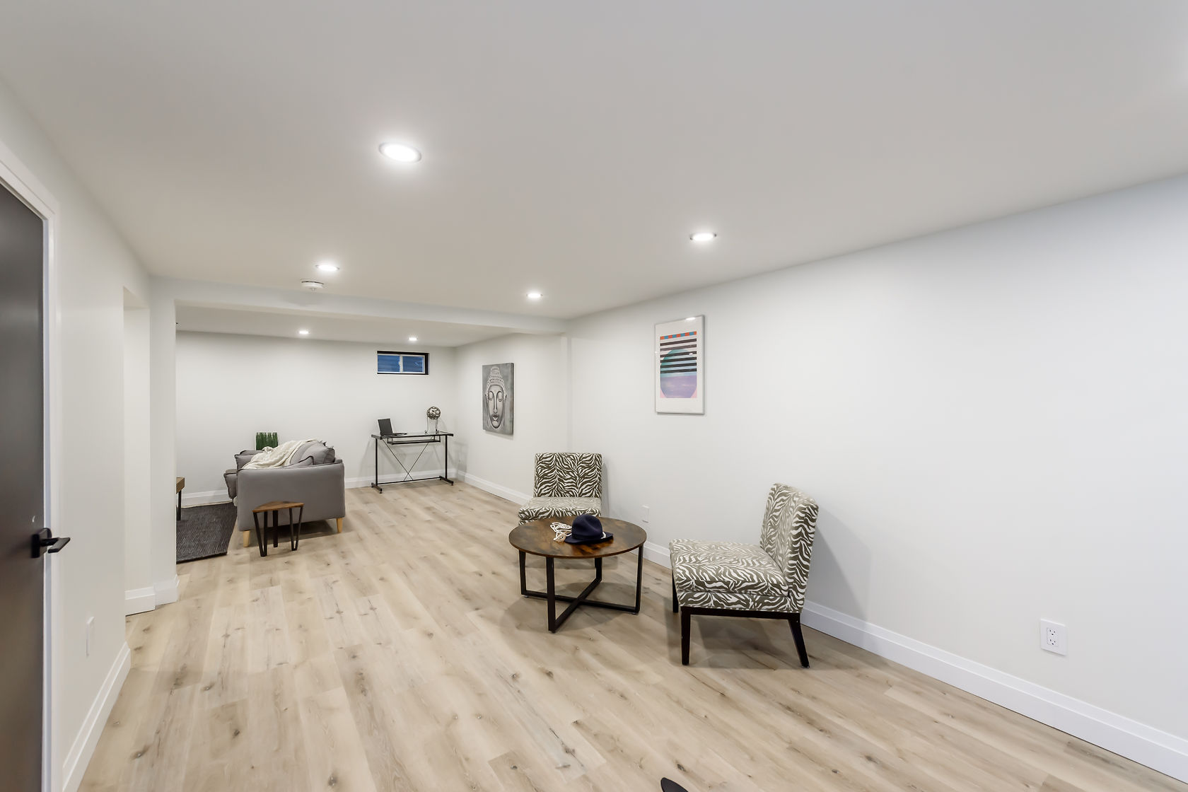 Bright finished basement with beautiful wood flooring and professional staging — Gateshead, Hamilton | MTC Renovations